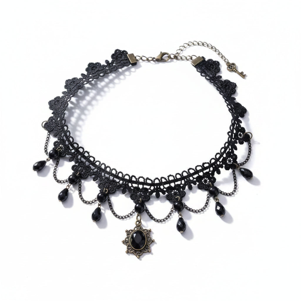 Gothic black lace floral filigree choker necklace with three draped antique bronze chains, multiple black faceted teardrop crystal bead drops, and antique bronze sunburst filigree oval black gemstone pendant; bronze lobster clasp with extender chain and small key charm; isolated on white background with soft drop shadow

