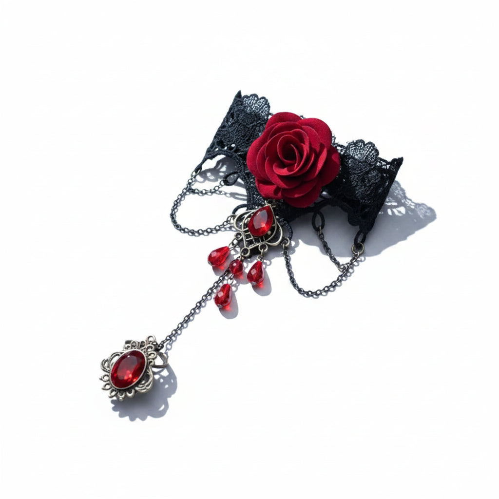 Gothic black lace wide wrist cuff slave bracelet ring set with 3D deep red fabric rose centerpiece, gunmetal chains, antique bronze diamond-frame red faceted crystal connector with four red teardrop crystal drops, connected to adjustable antique bronze filigree oval red gemstone ring; isolated on white background with soft drop shadow

