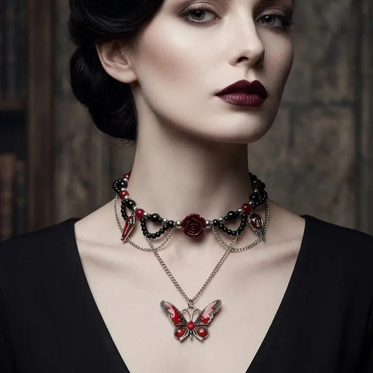 Woman with light skin tone and black updo wearing gothic black and red bead choker necklace with skull cameo, dark red rose, coffin cross charm and red enamel butterfly pendant, deep burgundy lips, black V-neck top, dark gothic wooden interior background, AI-generated model image

