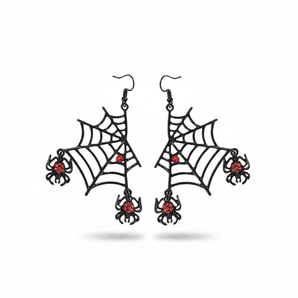 Pair of Halloween black alloy spider web hook earrings with irregular filigree web silhouette, one red rhinestone spider at web center and one red rhinestone spider drop at lower corner, black fish hook ear wire; isolated on white background with soft drop shadow

