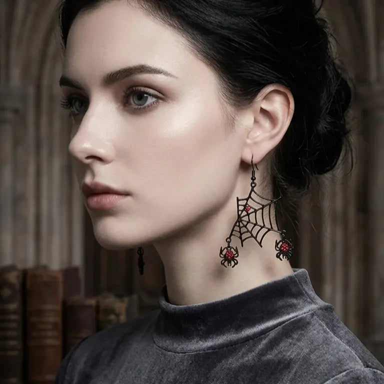 Woman with light skin tone and black updo wearing Halloween black alloy spider web hook earring on left ear with red rhinestone spider at web center and red rhinestone spider drop, grey turtleneck top, dark gothic arched library background, AI-generated model image

