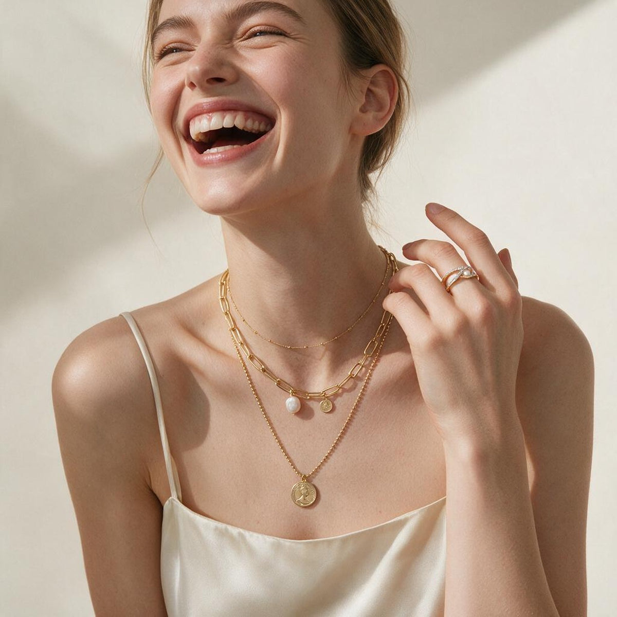 Model wearing the baroque simulated pearl layered necklace and the geometric simulated pearl ring together